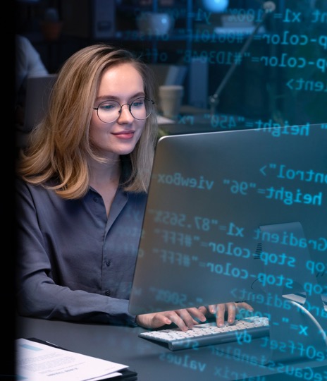 woman programming at a desk